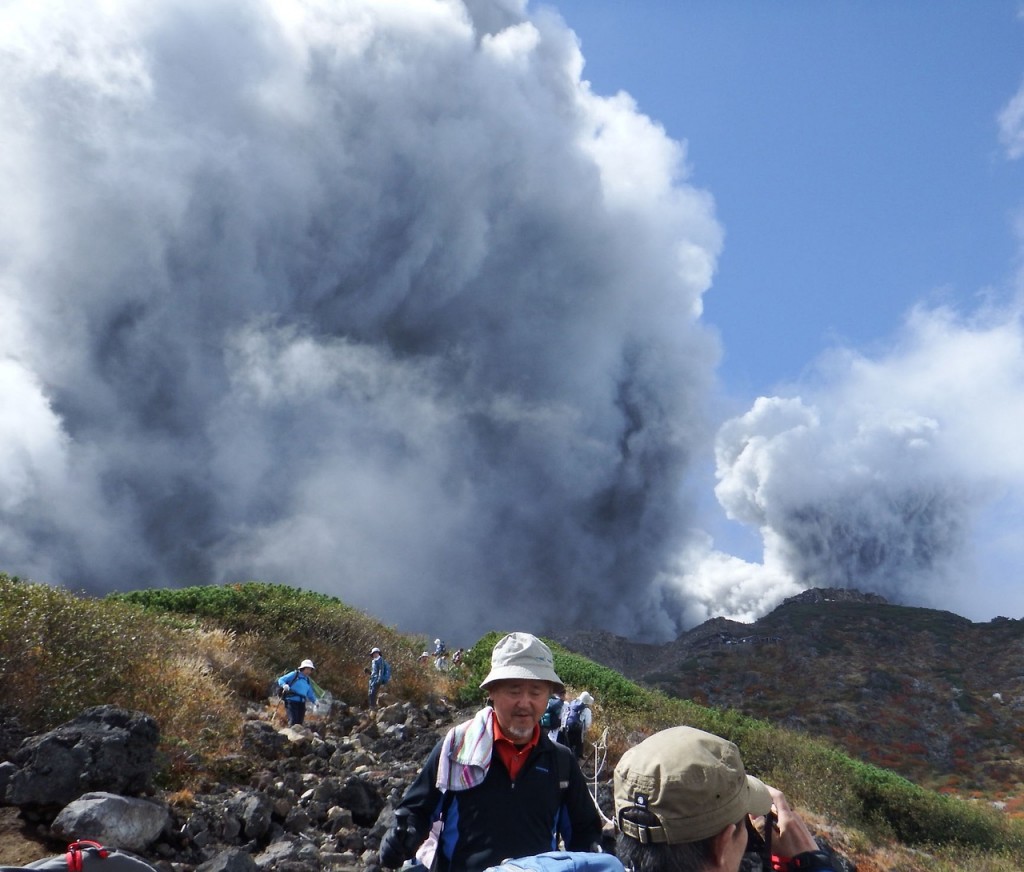 Climbers descend Mt. Ontake, which straddles Nagano and Gifu prefectures, to evacuate as the volcano erupts in central Japan